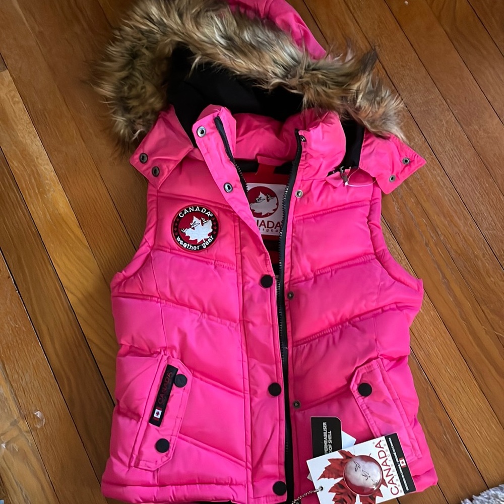 Brand new Womens vest with tags. Waterproof.